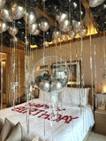 Black and silver ceiling balloons setup