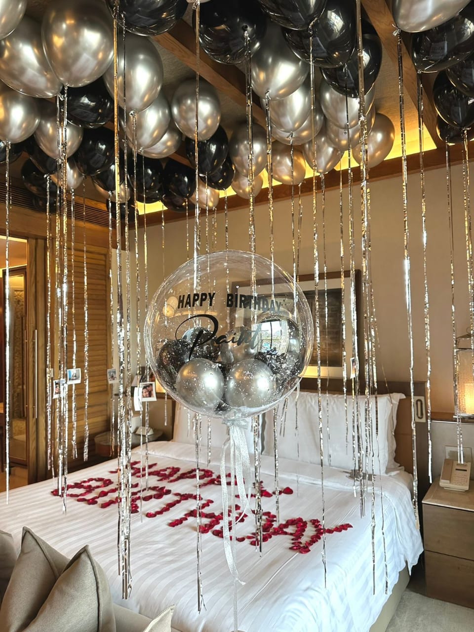 Black and silver ceiling balloons setup